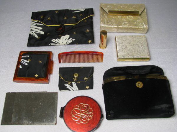 THREE VINTAGE COMPACTS WITH CLOTH CARRYING CASES: A lot of three assorted compacts with original carrying cases. First is a round, plastic, russet, 'Love-Pat', Revlon compact with golden R engraving on the lid. Comes with a black velvet carrying case
