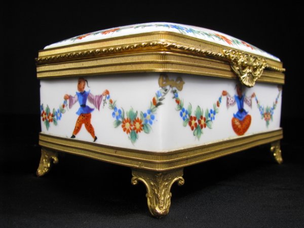 LIMOGES PORCELAIN CHINOISERE DRESSER VANITY BOX: Limoges porcelain vanity or dresser box with hand painted Chinoisere design, made exclusively for Saks Fifth Ave. Measures 3" tall x 5 1/2" long x 4" wide. No chips or cracks. Weighs 1 lb 1 oz.