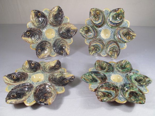 MAJOLICA OYSTER PLATES FISH DESIGN 4 PCS: Set of four majolica oyster plates with fish designs. Each measures 10" wide. Some chips, cracks, but mostly good condition. Weight is 5 lbs 2 oz.