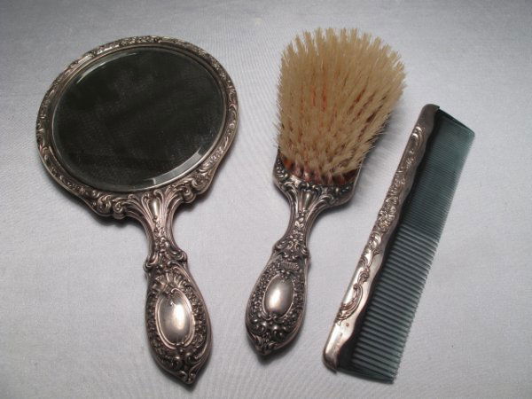 GORHAM STERLING SILVER DRESSER SET 3 PCS: Hand mirror measures 9 1/2" long x 5 1/2" wide, 8 troy, brush is 8 1/2" long x 3" wide, 6 troy and comb is 8" long and 2 troy. All pieces marked. Total shipping weight is 1 lb.