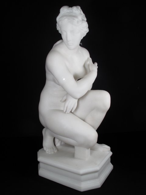 WHITE CARRARA MARBLE SCULPTURE CROUCHING VENUS: Unsigned white Carrara marble sculpture, Crouching Venus. Probably Italian school, late 19th century. Measures 22" tall.