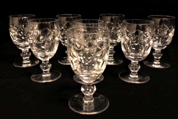EIGHT WATERFORD "KERRY" CRYSTAL WHITE WINE GLASSES: Lot of eight Waterford cut crystal white wine stems in the "Kerry" pattern. Each one measures 4.5" tall and is acid etched on the base. Condition: good, no chips or cracks, no fogging, see images. Wei
