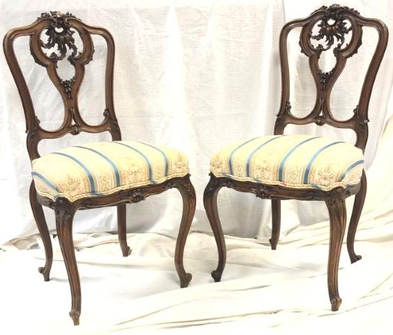 PAIR 19TH C LOUIS XV STYLE SIDE CHAIRS: Pair of 19th century Rococo or Louis XV style carved wood side chairs, each measuring 34.5" tall x 18" wide and 19" deep. Seat height 18". Condition: both chairs have minor repairs to back rest, norma