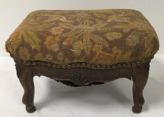 ANTIQUE FRENCH CARVED WALNUT TAPESTRY FOOTSTOOL: Antique French Country farmhouse carved walnut tapestry footstool. Tapestry depicts two birds, appears to be original. Mid 19th century. Measures 8.25" tall x 13.5" wide and 11" deep. Condition: heavy