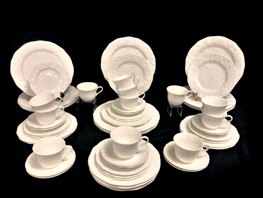 WEDGWOOD "STRAWBERRY & VINE" PORCELAIN DINNERWARE: Wedgwood "Strawberry & Vine" white porcelain dinnerware. Includes (12) 11" plates, (12) 8.5" plates, (12) 6.75" plates, (12) 5.75" saucers, and (12) 2.75" tall cups. Condition: good, no chips or crack