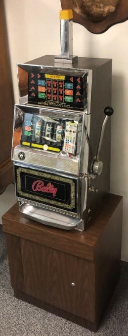 VINTAGE BALLY MODEL 831-ZZSH SLOT MACHINE: Vintage Bally model 831-ZZSH slot machine with lower cabinet. Includes key for the front slot machine door, lower cabinet door does not have key and is locked shut. Condition: does not power on when p