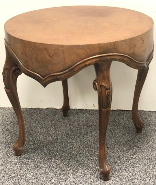 VINTAGE ITALIAN CARVED WOOD DRAPERY TABLE: Vintage Italian carved burled wood drapery form table. Measures 24" tall x 25.5" diameter. Drum style table with carving imitating a rug or fabric draped over the table top. Condition: fading to woode