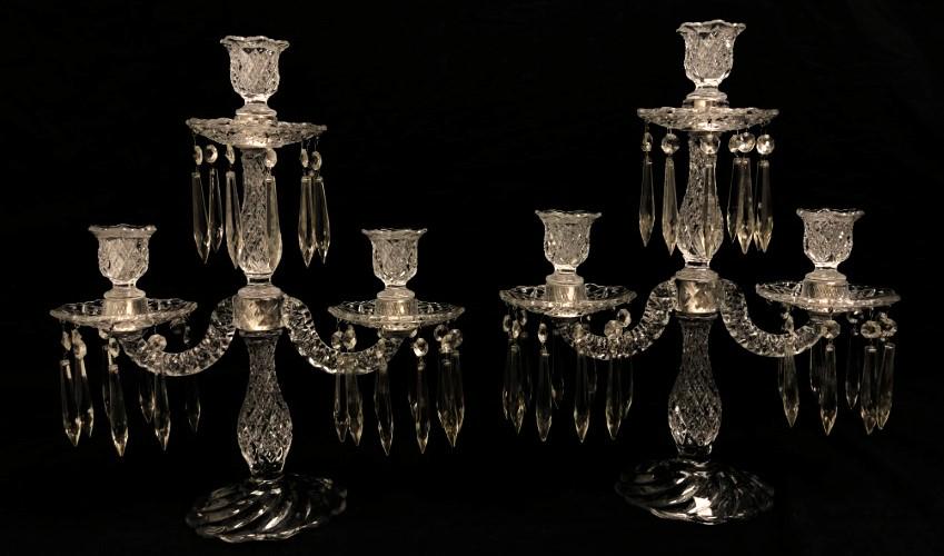 PAIR VINTAGE MOLDED GLASS THREE LIGHT CANDELABRA: Pair of vintage molded glass three light candelabra. Each one with cut crystal hanging prisms. Total height: 15.5" tall, width: 13.25" wide. The base of each one measures 5.25" diameter. Each candelab
