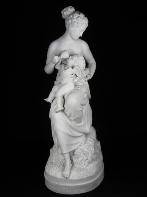 LARGE 19th C BISQUE FIGURE "CUPID BETRAYED": Victorian Parian Ware figure titled "Cupid Betrayed". Seated semi-nude woman holding cupid. Title is on the base. No maker marks. Measures 17 1/4" tall by 6 1/4" wide by 7" deep. Cupid is damaged with