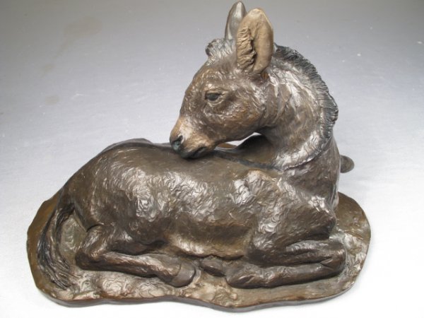 BRONZE SCULPTURE OF LYING DONKEY BY W H TURNER 200: Bronze sculpture of lying donkey by W. H. Turner, limited edition 126/300, 2004. Measures 6" tall x 11 1/2" long x 6 1/2" wide.