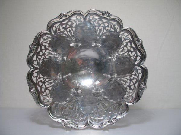LARGE STERLING SILVER ENGRAVED PIERCED ROUND TRAY: A sterling silver footed round tray with scalloped edge, pierced rim and floral engraved design. Monogram to center. Measures 14" wide. Troy weight: 24 oz. Shipping weight: 1.7 lbs. (UPDATED: 06/20/09