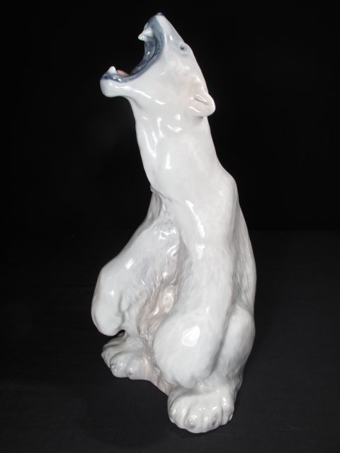 ROYAL COPENHAGEN ISBJORN HUGE ROARING POLAR BEAR: Royal Copenhagen porcelain figure of a roaring polar bear which measures 13 1/2" tall. Indistinct artists mark on reverse just above base rim. Incised number 502 and AW as well as Royal Copenhagen hal