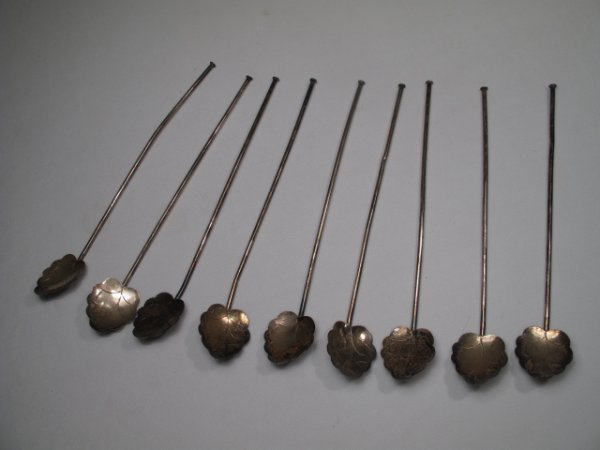 STERLING SILVER ICE TEA STRAW SPOONS 9 PIECES: Nine sterling ice tea Julep straw spoons. Stamped Mexico, 925 on back of spoons. Spoons measures 7 3/4" long by 1 1/4" wide. Three straw spoons have dings and are bent in the straws. Spoons weigh 2.5