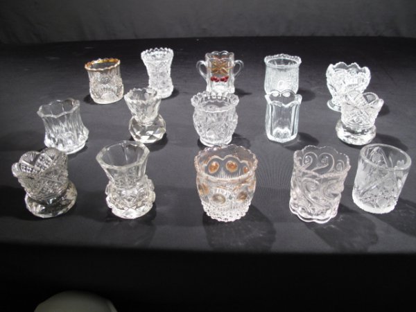 EAPG PRESSED PATTERN & GLASS TOOTHPICK HOLDERS 15P: An assortment of fifteen (15) Early American pressed glass, pattern glass and other glass toothpick holders. All in generally good condition. Shipping weight 4.0 lbs.