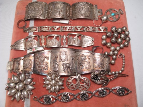 STERLING SILVER JEWELRY LOT BRACELETS PINS ETC: A nice assortment of South American and other sterling silver jewelry including two large linked cuff style bracelets, beaded necklace, earrings, rose deign bracelet with matching pin, rings and more.