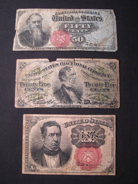 THREE ANTIQUE UNITED STATES FRACTIONAL CURRENCY NO: Three United States fractional currency notes including 50 cents, 25 cents, and 10 cents. Largest note is 4" x 1 7/8". Condition: Good with wear, folds. Piece missing from the margin of the 25 cent no