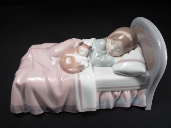 RETIRED LLADRO COZY COMPANIONS #6540 BOXED: Lladro porcelain figurine of a girl sleeping in bed. Model #6540. Title: "Cozy Companion". Height: 3 1/2". Length: 6 1/4". Weight: 2.0 lbs. Condition: Good with original box.