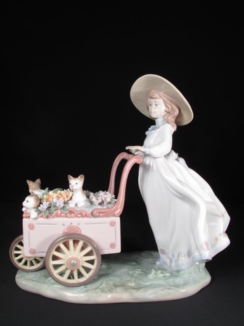 LLADRO PORCELAIN FIGURINE KITTY CART #6141 BOXED: Lladro porcelain figurine of a girl with a cart full of cats and flowers. Model #6141. Title: "Kitty Cart". Height" 8 1/2". Width: 9 1/2". Weight: 7.2 lbs. Condition: Good with original box.