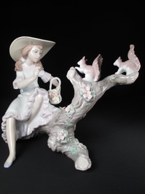 LLADRO PORCELAIN SPRINGTIME FRIENDS #6140 BOXED: Lladro porcelain figurine of a girl feeding squirrels. Model # 6141. Title: "Springtime Friends". Height: 7". Width: 8". Weight: 1.3 lbs. Condition: Good with original box.