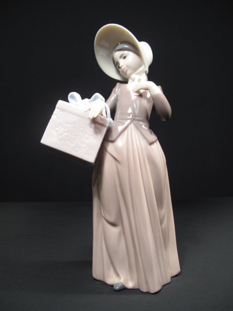 LLADRO PORCELAIN FIGURINE "GONE SHOPPING" BOXED: Lladro porcelain figurine of a girl with basket. Title: "Gone Shopping". Model # 6488. Height: 7 3/4". Width: 3". Weight: 0.7 lbs. Condition: Good with original box.