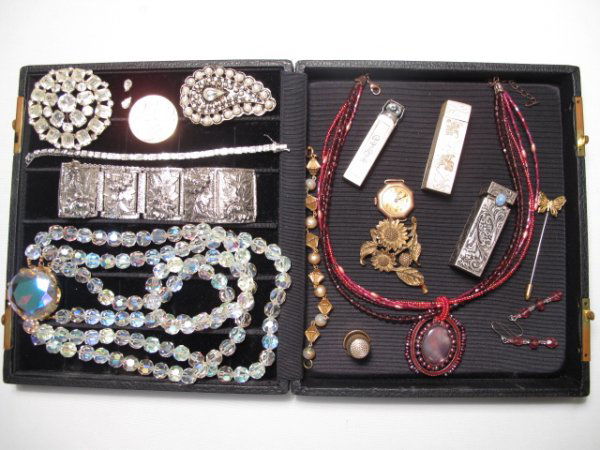 COSTUME JEWELRY LOT WEISS STERLING RHINESTONES ETC: Costume jewelry lot includes: large Weiss Co. rhinestone circular pin, large crystal bead necklace with gold tone fittings, two sterling silver lipstick cases, a vintage watch, gold tone thimble, ster