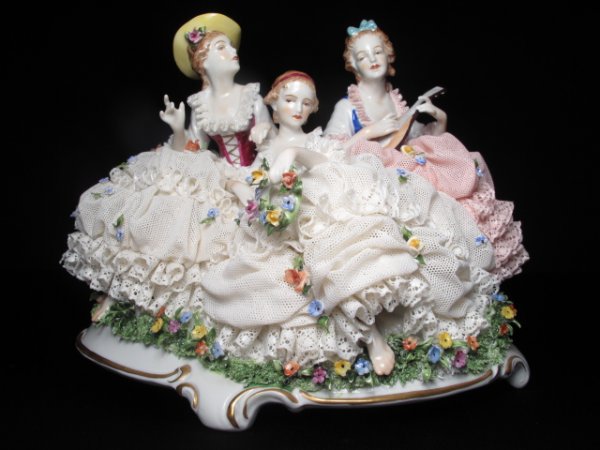 GERMAN LACE PORCELAIN FIGURINE THREE WOMEN: Hand painted porcelain figurine of three women with intricate lace dresses. Second half of the 20th Century. Germany. Length: 10". Width: 7". Height: 8". Weight: 4.3 lbs. Condition: good with some dam
