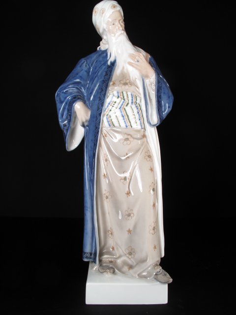 ROYAL COPENHAGEN FIGURE "NATHAN THE WISE" #1413: Hand painted porcelain figurine by Royal Copenhagen entitled, "Nathan the Wise" designed by Adolf Jahn. Height: 14 1/4" by 6 1/4" wide at its widest point. Weight: 3.0 lbs. Condition: good with a mino