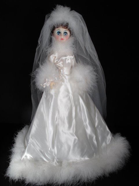 MADAME ALEXANDER DOLL BRIDE SATIN DRESS 18" TALL: Madame Alexander collectible doll of a bride with white satin dress with feather hem and lace veil. Height: 18". Weight: 1.6 lbs. Condition: good. (Clicked wrong item.... no update today.)
