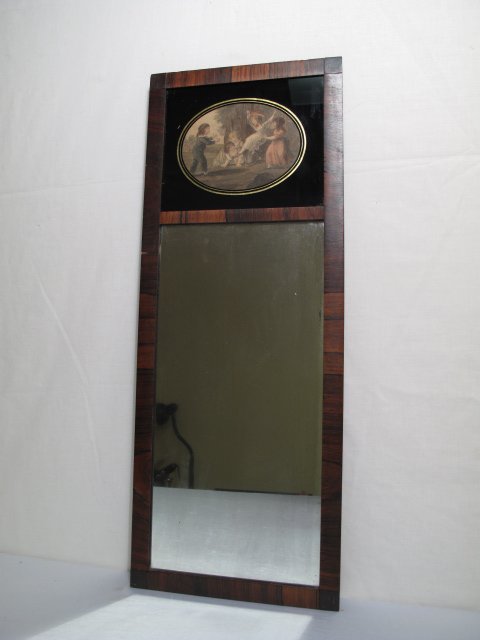 OLD VICTORIAN STYLE MIRROR CHILDREN PRINT: Old Victorian style mirror with inset print depicting children playing at top. Some loss of silvering on mirror. Slight chips to edge of frame. Measures 25 1/2" tall x 10" wide. Weight is 3 lbs.