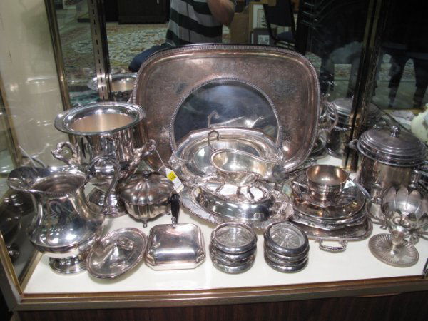 LOT OF 42 ASSORTED PIECES OF SILVER PLATE TABLE WA: Large lot of silver plate hollow ware including trays, a water pitcher, a wine bucket, an ice bucket, tazzas and coasters, among others. Various sizes and condition. Tallest piece is the wine cooler 1