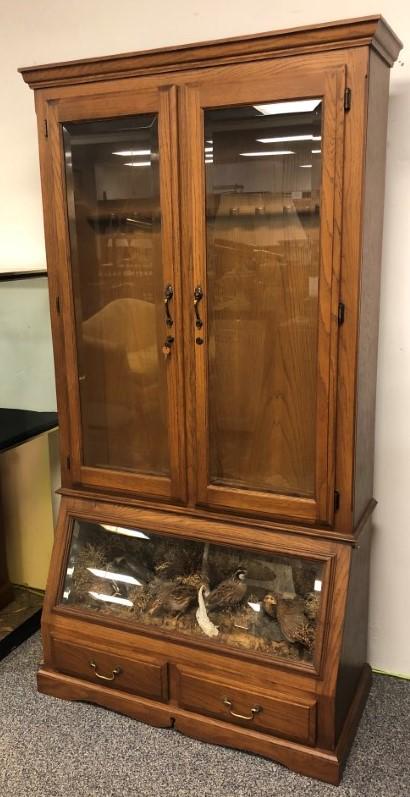 VINTAGE QUAIL TAXIDERMY DIORAMA RIFLE CABINET: Vintage oak rifle cabinet with a built in quail taxidermy diorama scene sealed in the cabinet below. Beveled glass on doors and lower window. Measures a total of 80" tall x 41" wide and 19.5" deep. Li