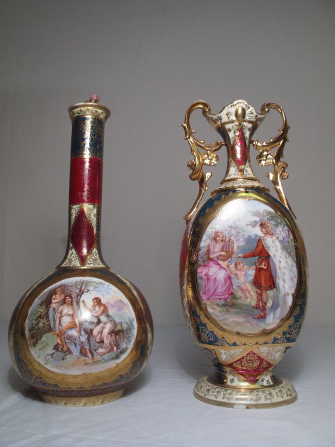 TWO VIENNA AUSTRIA ANTIQUE PORCELAIN VASE & BOTTLE: Antique Vienna, Austria porcelain vase and bottle. Late 19th or early 20th Century. Each piece is decorated with red, green and cream panels with polychrome classical medallions. Each with the Vienna