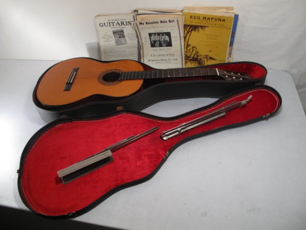 ALVAREZ CLASSICAL SPANISH GUITAR WITH CASE MUSIC: An Alvarez hand made classical guitar #5006, with original case, some sheet music and a music stand. Guitar measures 39" by 15" wide. Total weight: Approximately 20 lbs. Condition: some wear and alter
