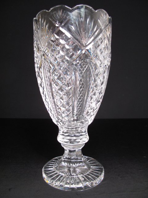 LARGE CLEAR CRYSTAL WATERFORD FOOTED VASE: Large clear crystal Waterford, Ireland, footed vase. Second half of the 20th Century. Signed on the underside of the foot rim. Height: 13". Diameter at widest point: 6 1/4". Weight: 7.5 lbs. Condition