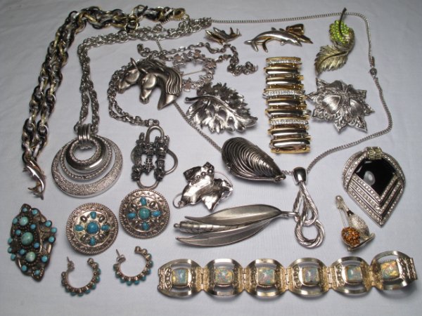 TWENTY PCS. VINTAGE & OTHER COSTUME JEWELRY MONET: Over twenty pieces of vintage and other costume jewelry including two pieces signed Monet, and a Mexican bracelet with faux opals. Various sizes, styles, and materials. Total weight: 1.5 lbs. Conditio