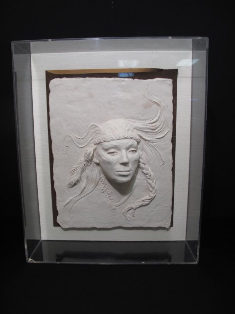 KAY HENKEL RELIEF SCULPTURE NATIVE AMERICAN INDIAN: Contemporary relief sculpture (Duracast or possibly plaster) of a native American by Kay Henkel. Signature of artist lower right. Henkel works as a full-time artist out of her studio and gallery in Pa