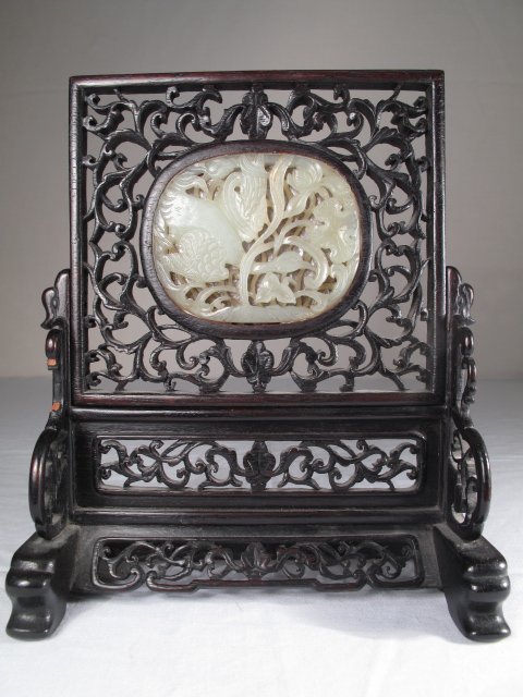 CHINESE QING CARVED JADE & WOOD TABLE SCREEN: Antique Qing Dynasty carved celadon jade medallion set into a carved Camphor wood mirror and stand. Mirror late 19th Century or early 20th Century. Jade medallion possibly earlier than frame. Jade car