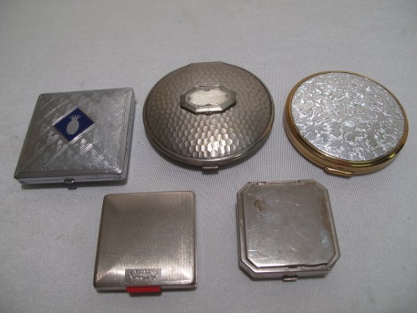 FIVE VINTAGE LADIES METAL COMPACTS COTY YARDLEY: Five vintage ladies metal compacts including two made by Cody of Paris. Second half of the 20th Century. Largest is circular and is 3 1/4" diameter. Smallest measures 2" x 2". Total weight: 1.1 lbs. C
