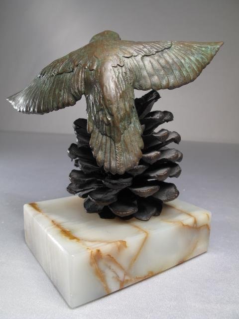 COLD PAINTED BRONZE OF A HUMMINGBIRD ON ONYX BASE: Cold painted bronze statue of a hummingbird on a pine cone signed indistinctly. One of an edition of 150. Sculpture is set on a green onyx base. Late 20th Century. Height: 5 1/2". Width of base: 4" x 