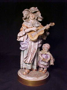 ITALIAN PORCELAIN STATUARY GROUP 1890'S: ITALIAN PORCELAIN STATUARY GROUP 1890'S Hand painted figural group "The Fortune Teller". 13 1/2" tall by 10" wide. Crack to base through skirt.