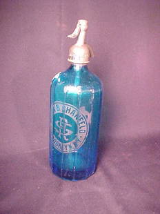 ANTIQUE BLUE GLASS SELTZER BOTTLE RUBIN: ANTIQUE BLUE GLASS SELTZER BOTTLE RUBIN & SHANFELD antique blue glass seltzer bottle. Measures 12" tall by 3 1/2" wide. Chips to shoulder area of bottle. General wear.