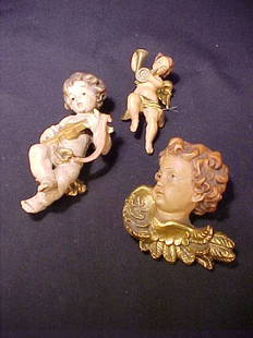3 HAND PAINTED ITALIAN CHERUB FIGURES T: 3 HAND PAINTED ITALIAN CHERUB FIGURES Three hand painted cherub figurines. 3 1/4" tall, 3 1/2" tall and 5" tall.