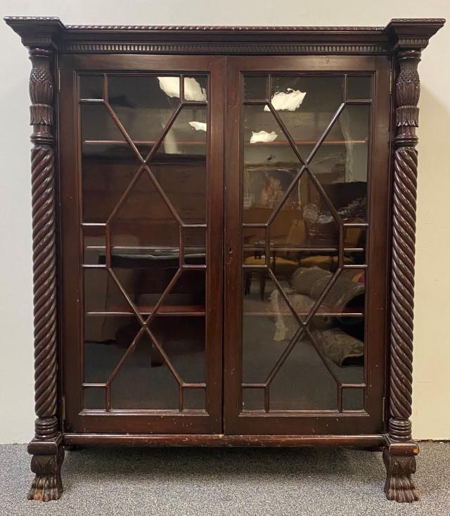 ANTIQUE CHIPPENDALE STYLE CARVED WOOD BOOKCASE: Antique Chippendale style carved wood claw foot bookcase. Measures a total of 61" tall x 53.5" wide and 19.5" deep. Does not include key. Condition: scattered minor losses, top right moulding is loose