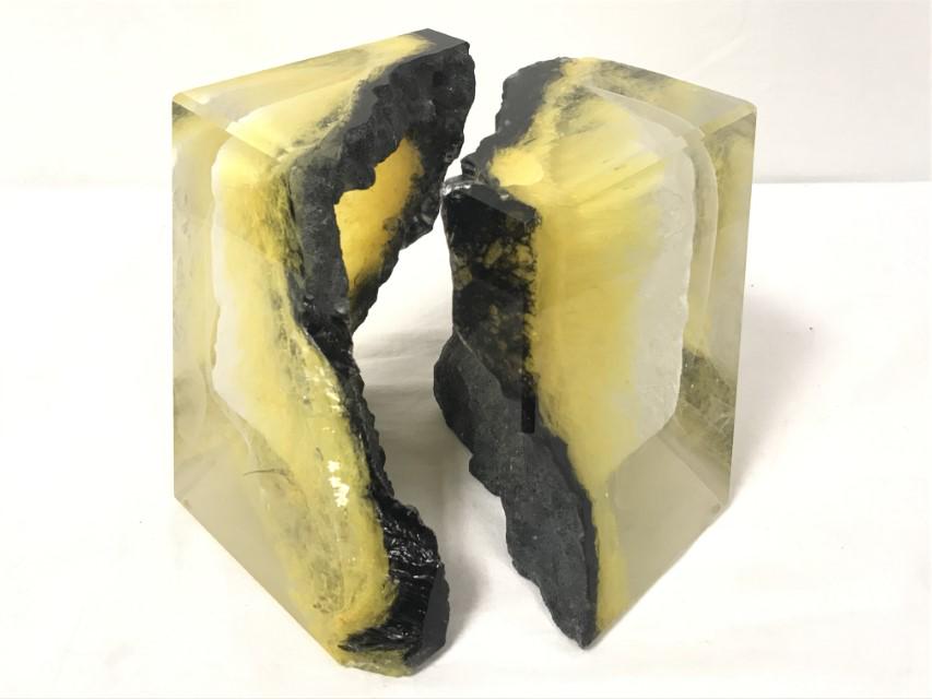 COLIN REID KILNCAST ART GLASS SCULPTURE: Colin Reid kilncast art glass sculpture. Two piece design resembling a cracked cube. Measures a total of 6-7/8" tall x 9-3/4" wide. Signed and dated vertically along one side "Colin Reid 1995 R703". C