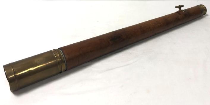 ELLIOTT BROS LONDON BRASS AND LEATHER TELESCOPE: Elliott Brothers London brass and leather two-draw telescope. Measures 32" long when fully reduced and approximately 44" long fully extended. Condition: some tearing to leather sheath binding, lenses 