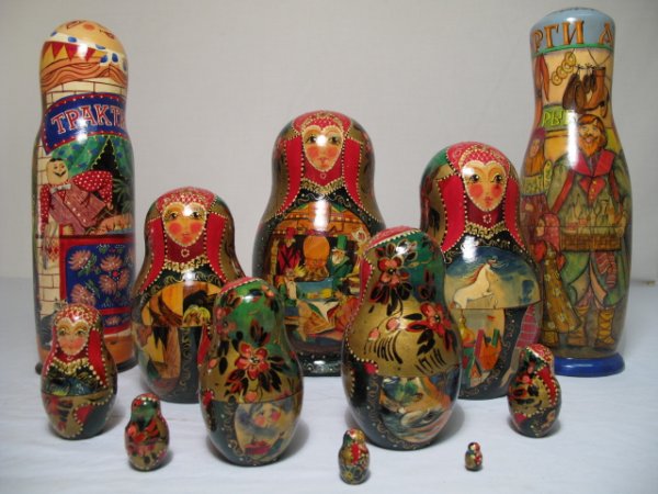 THREE LACQUERED WOOD RUSSIAN BABUSHKA DOLLS SIGNED: Three lacquered wood Russian "babushka" dolls, each one signed by the artisan. Various traditional Russian scenes. Hand painted with vibrant colors. Late 20th Century. Height of tallest figure: 12 1/2