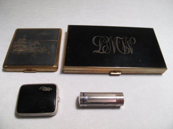 THREE VINTAGE LADIES COMPACTS & ONE CODY LIPSTICK: Three vintage ladies compacts including a large one by Volupte along with an Art Deco period lipstick by Coty of Paris. All 20th Century. Largest ensemble compact measures 5 1/4" x 3" x 1/2" thick. Sm