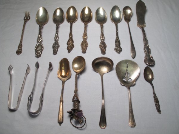 FIFTEEN ASSORTED STERLING FLATWARE SERVING PIECES: Fifteen assorted sterling silver flatware, various makes and styles. Lot includes 2 sugar tongs, a master butter knife, a pickle fork, and various ornate tea spoons. Length of longest piece: 8". Lengt