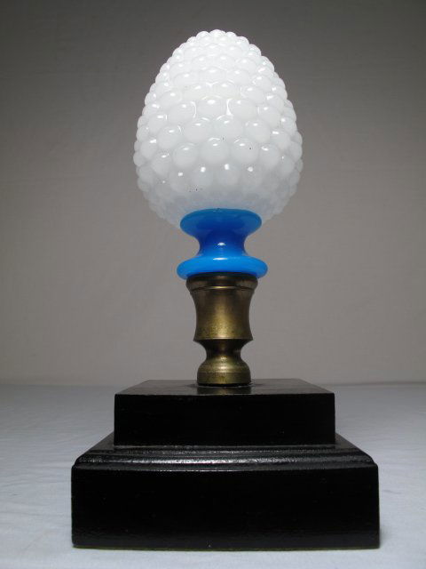 ANTIQUE BRISTOL GLASS NEWELL POST FINIAL: Antique blue and white blown bristol glass newell post finial, late 19th Century. Set on a later wood base. Height: 11". Base measures 5" x 5" x 2 1/2". Total weight: 2.6 lbs. Condition: good.