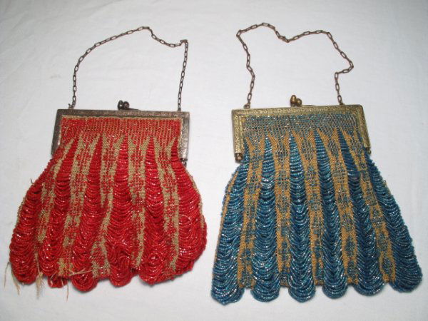 TWO ANTIQUE BEADED PURSES - 1 RED, 1 BLUE: Two antique beaded purses. Late 19th to early 20th century. Each with white metal engraved frames and chain straps. Bodies are ecru fabric with beading in a drape or waterfall design. Red purse with l